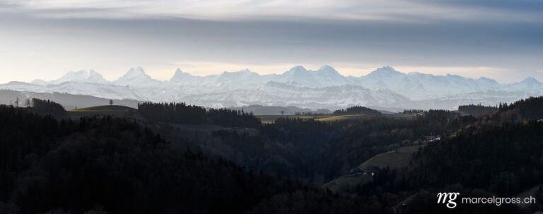 . Panoramic view from Emmental with the Bernese Alps in the distance. Marcel Gross Photography